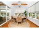 Sunlit dining room with wood floors and outside views at 1804 Clifton Pines Dr, Cary, NC 27519