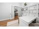 Bright home office featuring a large desk, built-in bookshelves, and stylish decor at 1804 Clifton Pines Dr, Cary, NC 27519