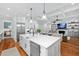 Open concept kitchen with stainless appliances and views to the living area at 1804 Clifton Pines Dr, Cary, NC 27519