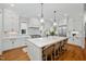 Modern kitchen with stainless steel appliances, central island and bar stool seating at 1804 Clifton Pines Dr, Cary, NC 27519