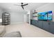 Spacious room with ceiling fan, recessed lighting, neutral carpet, and TV at 1804 Clifton Pines Dr, Cary, NC 27519