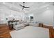 Spacious living room with hardwood floors, coffered ceilings, and a large sofa at 1804 Clifton Pines Dr, Cary, NC 27519