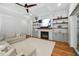 Bright living room with fireplace, built-in shelves and outside access at 1804 Clifton Pines Dr, Cary, NC 27519