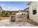 Backyard features a stone outdoor kitchen and stainless steel appliances at 1804 Clifton Pines Dr, Cary, NC 27519