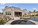 This backyard features a pool, spa, covered patio with seating, and a grill area perfect for outdoor entertaining at 1804 Clifton Pines Dr, Cary, NC 27519