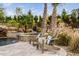 Beautiful outdoor space with custom pool with waterfall feature, mature landscaping, and lounge chairs at 1804 Clifton Pines Dr, Cary, NC 27519