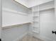 Spacious walk-in closet with built in shelving and two separate clothing rods at 1804 Clifton Pines Dr, Cary, NC 27519