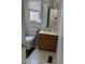 Cozy bathroom featuring a toilet, vanity with a mirror, and good lighting at 1811 Kelly Glen Dr, Apex, NC 27502