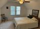 Cozy bedroom featuring a comfortable bed, natural light through the window, and a calm, inviting space at 1811 Kelly Glen Dr, Apex, NC 27502