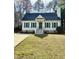 Charming one-story home with green shutters, dark roof, chimney and well-manicured front lawn at 1811 Kelly Glen Dr, Apex, NC 27502