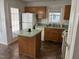 Functional kitchen with a center island, ample counter space, and matching appliances at 1811 Kelly Glen Dr, Apex, NC 27502
