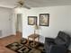 Inviting living room features gleaming hardwood floors, an overhead light and fan, and neutral tones at 1811 Kelly Glen Dr, Apex, NC 27502