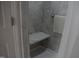 Modern shower area with a built-in seat, sleek tile, and a shower curtain at 1811 Kelly Glen Dr, Apex, NC 27502