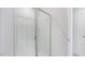 Glass shower with white tiled walls and modern fixtures at 1912 Frost Dr, Haw River, NC 27258