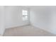Comfortable carpeted bedroom with a window offering natural light at 1912 Frost Dr, Haw River, NC 27258