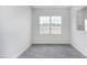 Bright dining area featuring modern flooring and a large window with backyard views at 1912 Frost Dr, Haw River, NC 27258