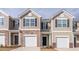 Inviting townhouse with a one-car garage and appealing stone and siding facade at 1912 Frost Dr, Haw River, NC 27258