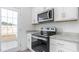Modern kitchen features granite countertops, stainless steel appliances, and ample cabinet space at 1912 Frost Dr, Haw River, NC 27258