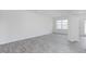 Airy living room with modern flooring and a large window for natural light at 1912 Frost Dr, Haw River, NC 27258