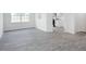 Open floor plan showcasing modern flooring connecting the living area and kitchen at 1912 Frost Dr, Haw River, NC 27258