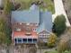 Aerial view showcasing the home's deck, patio, and beautifully landscaped yard at 204 Brittany Pl, Cary, NC 27511