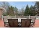 Expansive back deck perfect for entertaining with outdoor dining table and view of the trees at 204 Brittany Pl, Cary, NC 27511