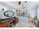 Bathroom with a glass-enclosed shower, vanity and wood cabinets with black granite countertops at 204 Brittany Pl, Cary, NC 27511