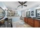 Well-lit bathroom with a glass-enclosed shower, double vanity, tub and black granite countertops at 204 Brittany Pl, Cary, NC 27511