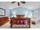 Spacious bedroom with vaulted ceiling, plush bed, and ample natural light at 204 Brittany Pl, Cary, NC 27511