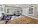 Bright home gym featuring exercise equipment, a ceiling fan, and natural light from the window at 204 Brittany Pl, Cary, NC 27511