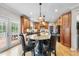 Spacious kitchen with custom wood cabinets, stone countertops, and a center island with seating at 204 Brittany Pl, Cary, NC 27511