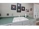 A close up view of the sink and countertop with decorative wall art in the kitchen at 204 Brittany Pl, Cary, NC 27511