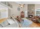 Spacious living room with a stone fireplace, wooden floors, and comfortable seating at 204 Brittany Pl, Cary, NC 27511