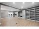 Spacious living room with built-in cabinets and shelving, and access to the outdoors at 204 Brittany Pl, Cary, NC 27511
