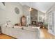 Cozy living room featuring a stone fireplace, vaulted ceilings, and comfortable seating at 204 Brittany Pl, Cary, NC 27511