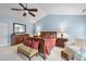 Spacious main bedroom with vaulted ceiling, sitting area and large bed with upholstered bench at 204 Brittany Pl, Cary, NC 27511