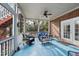 Comfortable screened porch features ceiling fan, cozy seating and a serene backyard view at 204 Brittany Pl, Cary, NC 27511
