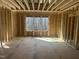 Framed bedroom showcasing natural light ready for insulation and customization to your taste at 211 Meadow Walk Dr, Fuquay Varina, NC 27526