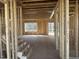 Spacious interior framing of a new construction home, showcasing the layout and natural light at 211 Meadow Walk Dr, Fuquay Varina, NC 27526