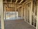 Interior framing shows space for windows and the staircase of the interior of the new home at 211 Meadow Walk Dr, Fuquay Varina, NC 27526