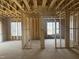 Interior framing shows space for windows and the interior structure of the new home at 211 Meadow Walk Dr, Fuquay Varina, NC 27526