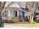Charming front exterior featuring a covered porch, landscaped yard, and inviting entrance at 2606 W Knox St, Durham, NC 27705