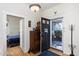 Inviting foyer with hardwood floors and a view into the bedroom at 2606 W Knox St, Durham, NC 27705
