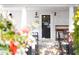 Close-up of the charming front door and porch with decorations at 2606 W Knox St, Durham, NC 27705