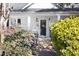 Inviting front porch with steps leading to the front door and lush greenery at 2606 W Knox St, Durham, NC 27705