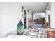 Cozy covered front porch with a table, chairs, and a porch swing at 2606 W Knox St, Durham, NC 27705