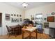 Open kitchen with a large butcher block island, dining table, and plentiful decorations at 2606 W Knox St, Durham, NC 27705