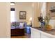 Living room with hardwood floors, a comfortable sofa, and natural light at 2606 W Knox St, Durham, NC 27705