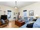 Bright living room with hardwood floors and large windows at 2606 W Knox St, Durham, NC 27705