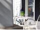Cozy porch with seating, side table, and stylish decor for outdoor relaxation at 2606 W Knox St, Durham, NC 27705